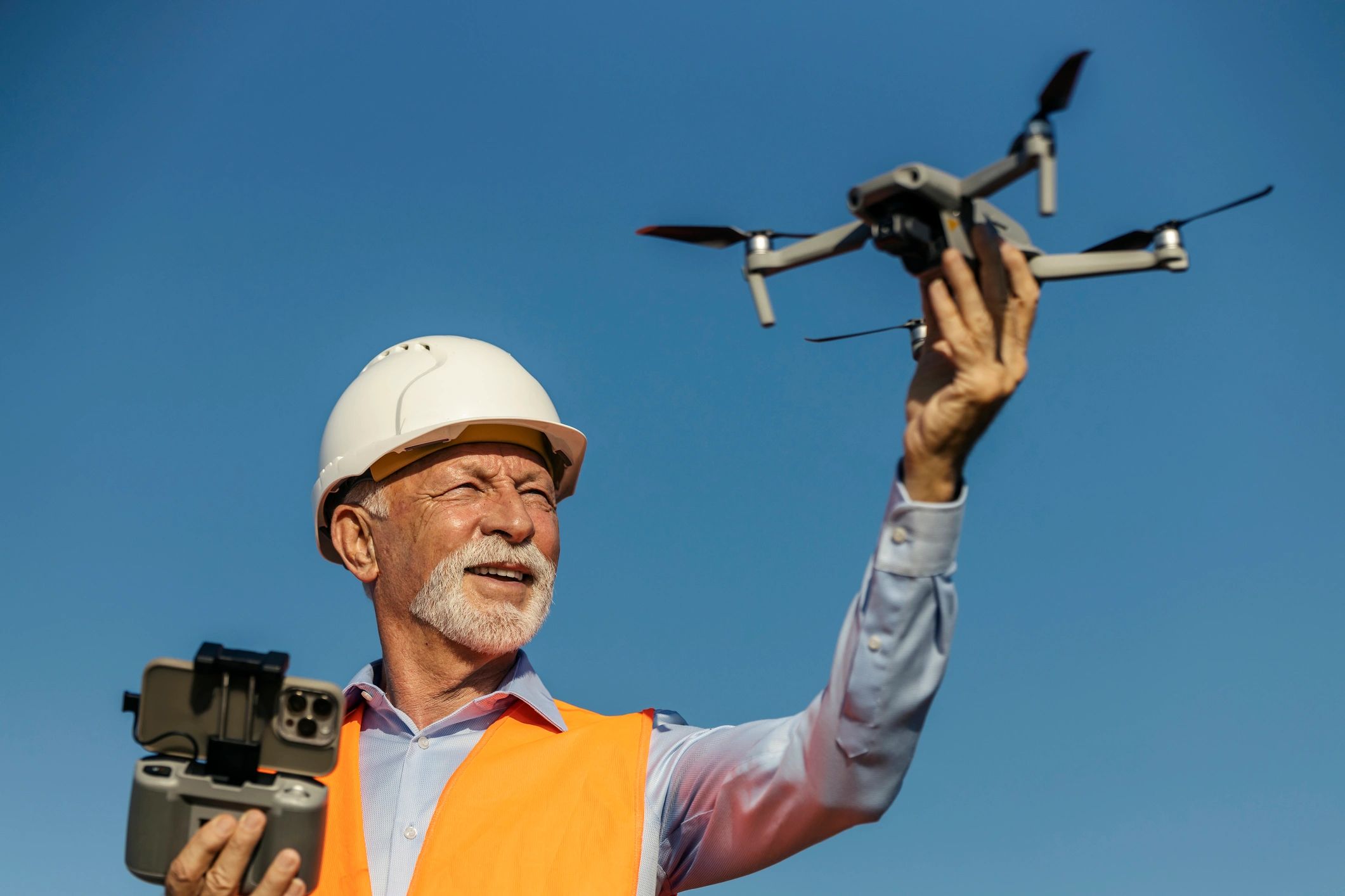 Drone operator preparing equipment outdoors
